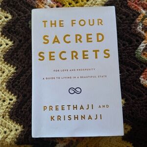 The Four Sacred Secrets by Preethaji and Krishnaji - White & Gold Hardcover Book